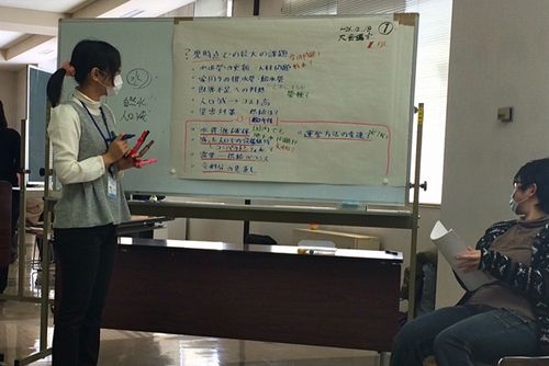 Photo: A facilitator writing down participants' comments